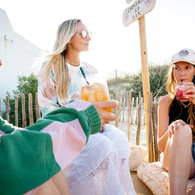 a drink on the beach with friends