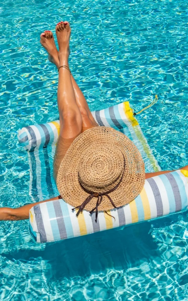 woman in luxury five stars spa resort in the swimming pool.