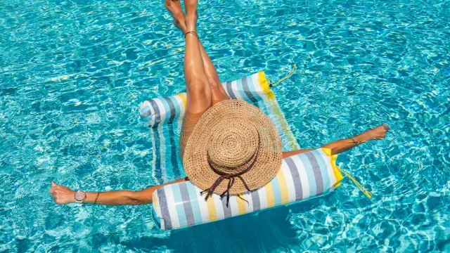 woman in luxury five stars  spa resort in the swimming pool.