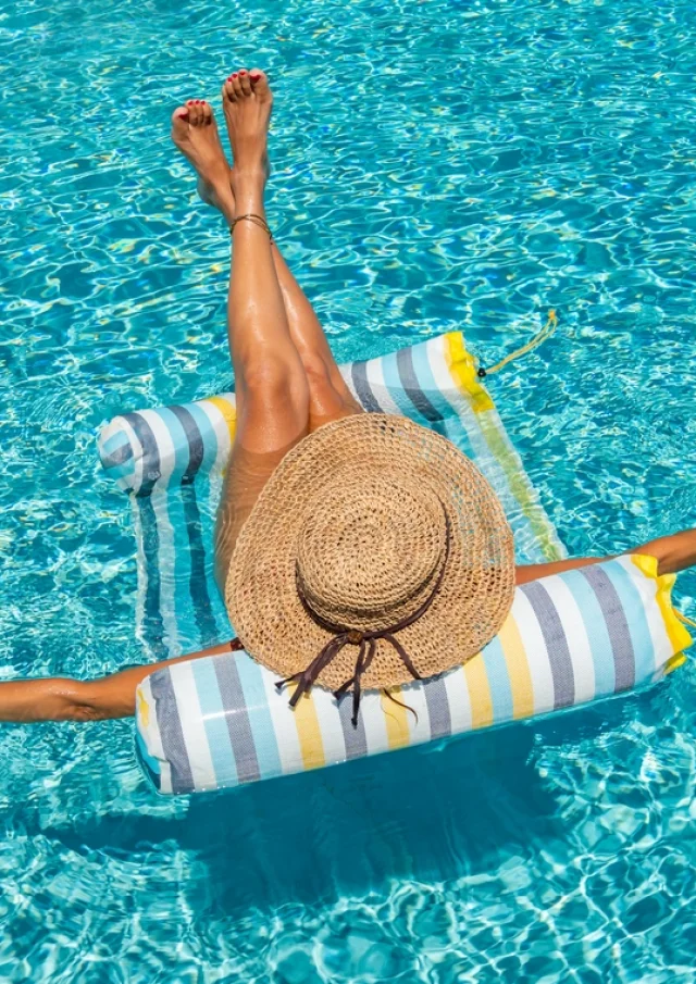 woman in luxury five stars spa resort in the swimming pool.